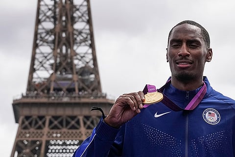 2012 London Olympic men's high jump: Erik Kynard of the United States poses with his gold medal